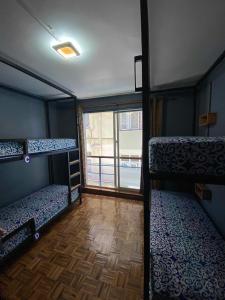 Postel nebo postele na pokoji v ubytování Alobar1000 Hostel + 37 fotografií