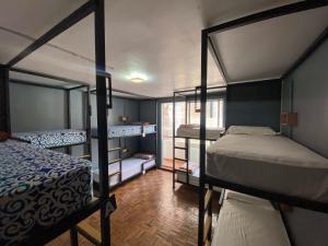 a room with two bunk beds and a room with at Alobar1000 Hostel in Kathmandu