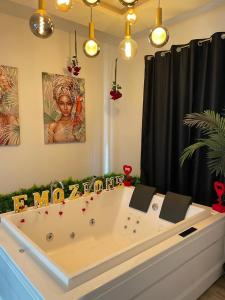 a large bath tub in a room with christmas decorations at B&B Emozione in Campobasso