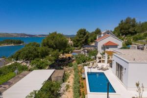 an aerial view of a house with a swimming pool at Sullago in Šibenik