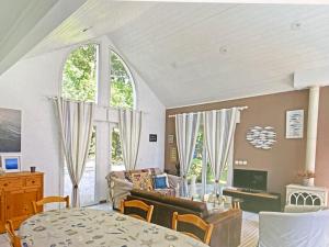 a living room with a couch and a table at Louise-Angèle in Biscarrosse