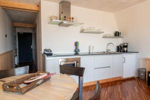 Virtuvė arba virtuvėlė apgyvendinimo įstaigoje 4T4 Apartment C