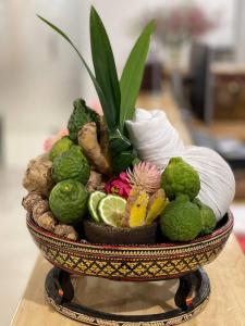 a bowl filled with different types of fruits and vegetables at Ban Ban Hotel in Phnom Penh