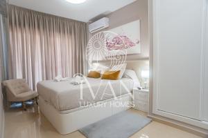 Posteľ alebo postele v izbe v ubytovaní Casa Nala Ivan Luxury Homes 6ªPlta Norte 1ªLinea