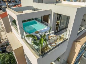 an aerial view of a building with a swimming pool at Disegno Residences in Chania Town