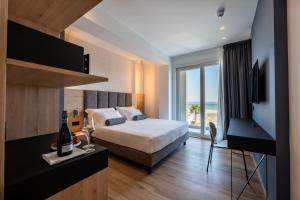 Postel nebo postele na pokoji v ubytování Hotel Sporting Riccione