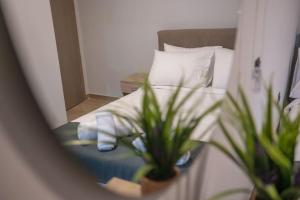 Ένα ή περισσότερα κρεβάτια σε δωμάτιο στο Aurora Apartments - Room 2