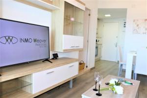 Telewizja i/lub zestaw kina domowego w obiekcie 56C Vora vistas al mar parking y wifi