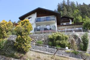 a house on top of a stone wall at Panorama Appartements Mora - 3 Edelweiß Superior in Oetz