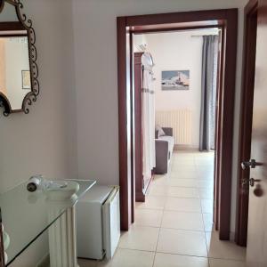 a bathroom with a sink and a mirror at Mediterraneo Camere in Otranto +41 photos