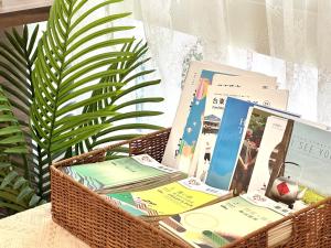a basket filled with books on top of a table at 永安101 Wing on x 附陽台 in Taitung City