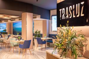 a restaurant with tables and chairs and a sign that reads pasta at Melia Alicante in Alicante