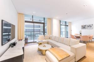 a living room with a couch and a table at NEW! Luxurious 3 bedroom apartment in City Walk in Dubai
