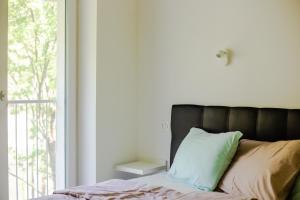 Postel nebo postele na pokoji v ubytování APARTMAJI SILVA