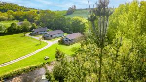 an aerial view of a house in a field at The Clover Lodge, Red Lake Farm Nr Glastonbury in Somerton