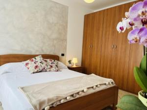 Postel nebo postele na pokoji v ubytování Casa Ulivi Silver