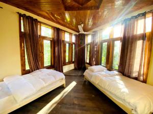Postel nebo postele na pokoji v ubytování Manasau Resort