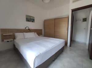 Łóżko lub łóżka w pokoju w obiekcie Para Thin Alos Inn