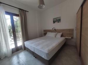 Łóżko lub łóżka w pokoju w obiekcie Para Thin Alos Inn