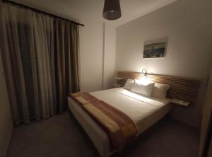 Łóżko lub łóżka w pokoju w obiekcie Para Thin Alos Inn