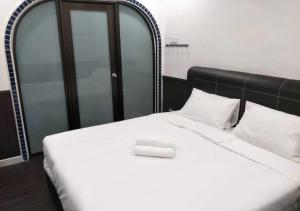 Postel nebo postele na pokoji v ubytování RV @ U GARDEN STAY