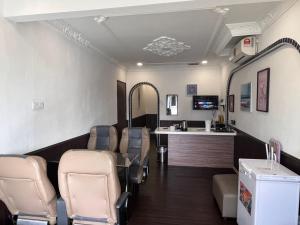 a salon with chairs and a waiting room at RV @ U GARDEN STAY in Skudai