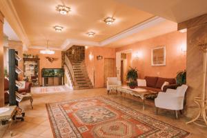 a living room with a couch and a table at Hotel Montana in Obertauern