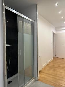 a glass door in a room with a hallway at Areilza by Forever Rentals in Bilbao +30 photos