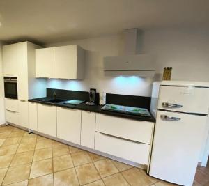 Kuchyň nebo kuchyňský kout v ubytování Apartment Am Haullenbach