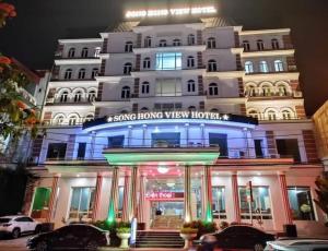 a building with a sign that reads living home view hotel at SONG HONG VIEW HOTEL in Lao Cai