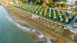 an aerial view of a beach with chairs and umbrellas at Voyage Sorgun Hotel in Side
