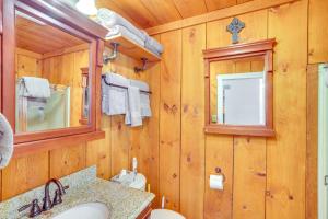 a wooden bathroom with a sink and a mirror at Windham Mountain Vacation Rental about 3 Mi to Lifts! in Windham +29 photos