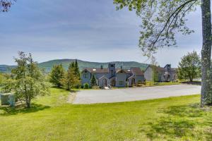 a house with a driveway in front of a mountain at Windham Mountain Vacation Rental about 3 Mi to Lifts! in Windham