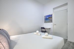 Łóżko lub łóżka w pokoju w obiekcie Atocha Station - Apartamento de 2 dormitorios
