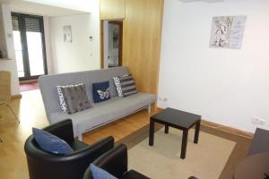 a living room with a couch and a table at Best Apartments Portugal in Lisbon