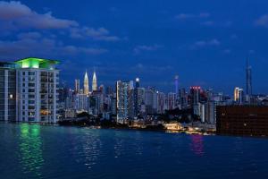 a view of a city skyline at night at The Pano Residence Jalan Ipoh Insta-worthy Bath Tub Studio 浴缸MRT in Kuala Lumpur