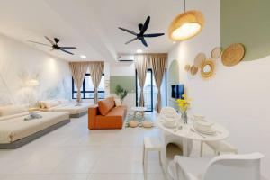 a living room with a couch and a table at The Pano Residence Jalan Ipoh Insta-worthy Bath Tub Studio 浴缸MRT in Kuala Lumpur