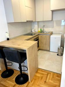 a small kitchen with a counter and a sink at Apartment Dream in Trebinje