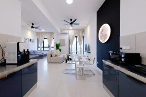 a kitchen and living room with a couch and a table at The Pano Residence Jalan Ipoh Insta-worthy Bath Tub Studio 浴缸MRT in Kuala Lumpur
