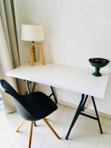 a white desk with a black chair and a lamp at Retro Chic 100m2 Flat, in Center with Terrace and Parking- 92 in Luxembourg