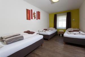 Ένα ή περισσότερα κρεβάτια σε δωμάτιο στο Rutsche Hostel