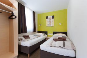 Ένα ή περισσότερα κρεβάτια σε δωμάτιο στο Rutsche Hostel