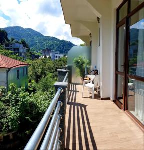 a balcony of a house with a view at GARDEN IN GONIO MATATA MOTSIKULIS 58 in Batumi