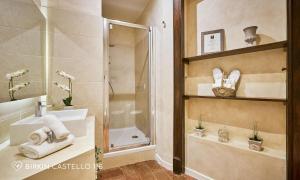 a bathroom with a shower and a sink and a shower at Albergo Diffuso Birkin Castello in Cagliari