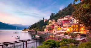a town on the shore of a lake at dusk at Wonder View - relax and nature in Varenna