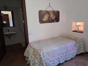 Postel nebo postele na pokoji v ubytování Antico Borghetto - Casa Vacanze