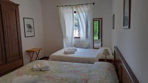 Postel nebo postele na pokoji v ubytování Antico Borghetto - Casa Vacanze
