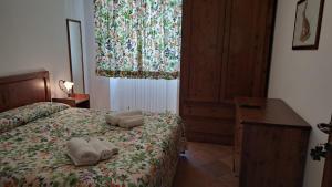 Postel nebo postele na pokoji v ubytování Antico Borghetto - Casa Vacanze