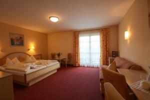 Ένα ή περισσότερα κρεβάτια σε δωμάτιο στο Hotel Gasthof Neuner