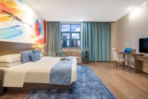 TV a/nebo společenská místnost v ubytování Zhongshan Bafei Hotel